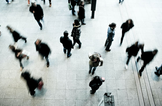 Photo of people walking in different directions taken from above