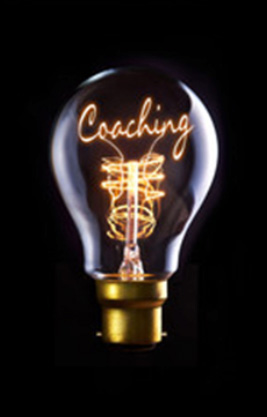 A lightbulb with coaching written inside